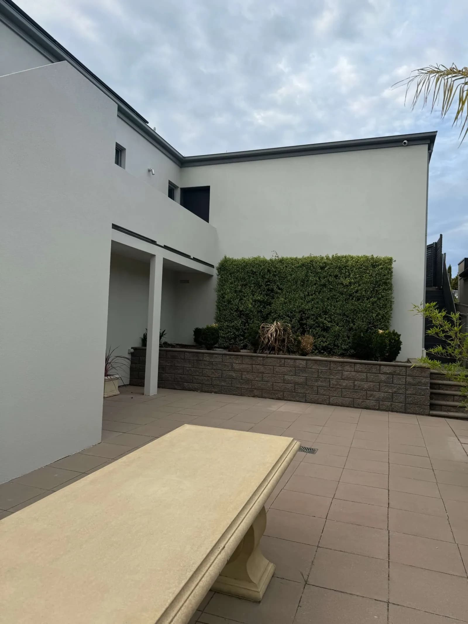 Rendered two-storey home with a smooth white exterior finish